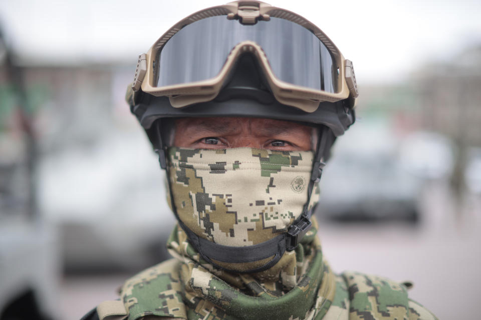 VARIOUS CITIES, MEXICO - SEPTEMBER 16: Mexican soldier looks on during the Independence Day military parade at Zocalo Square on September 16, 2020 in Various Cities, Mexico. This year El Zocalo remains closed for general public due to coronavirus restrictions. Every September 16 Mexico celebrates the beginning of the revolution uprising of 1810. (Photo by Hector Vivas/Getty Images)