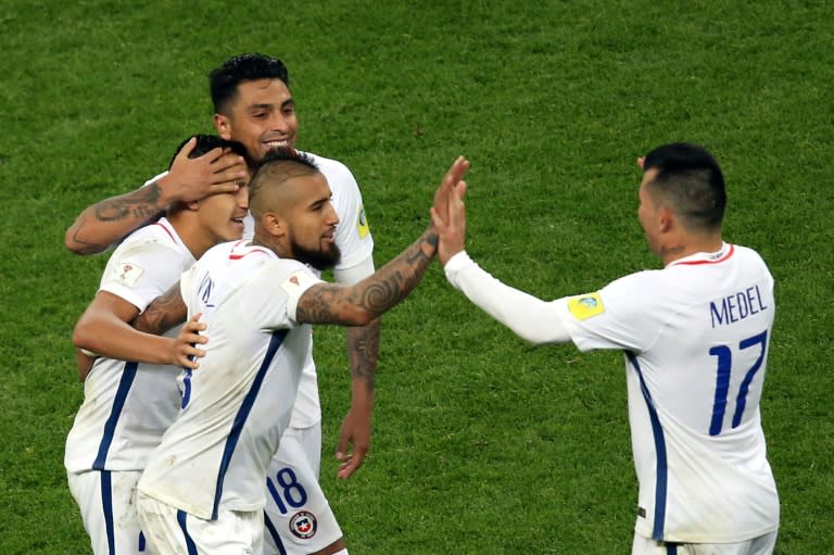 Chile's midfielder Arturo Vidal (C) celebrates with team mates after Chile won the 2017 Confederations Cup semi-final football match against between Portugal June 28, 2017