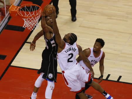 May 25, 2019; Toronto, Ontario, CAN; Toronto Raptors forward Kawhi Leonard (2) dunks against Milwaukee Bucks forward Giannis Antetokounmpo (34) as Raptors guard Kyle Lowry (7) looks on during the second half of game six of the Eastern conference finals of the 2019 NBA Playoffs at Scotiabank Arena. John E. Sokolowski-USA TODAY Sports