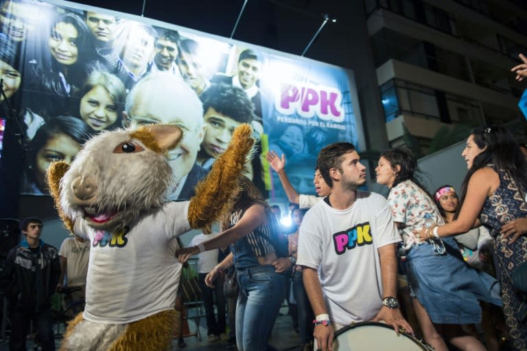 Supporters of presidential candidate Pedro Pablo Kuczynski of the "Peruanos por el Kambio" party celebrate in Lima, on April 10, 2016