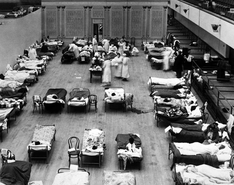 The Oakland Municipal Auditorium is being used as a temporary hospital with volunteer nurses from the American Red Cross tending the sick there during the influenza pandemic of 1918, Oakland, California, 1918. (Photo by Underwood Archives/Getty Images)