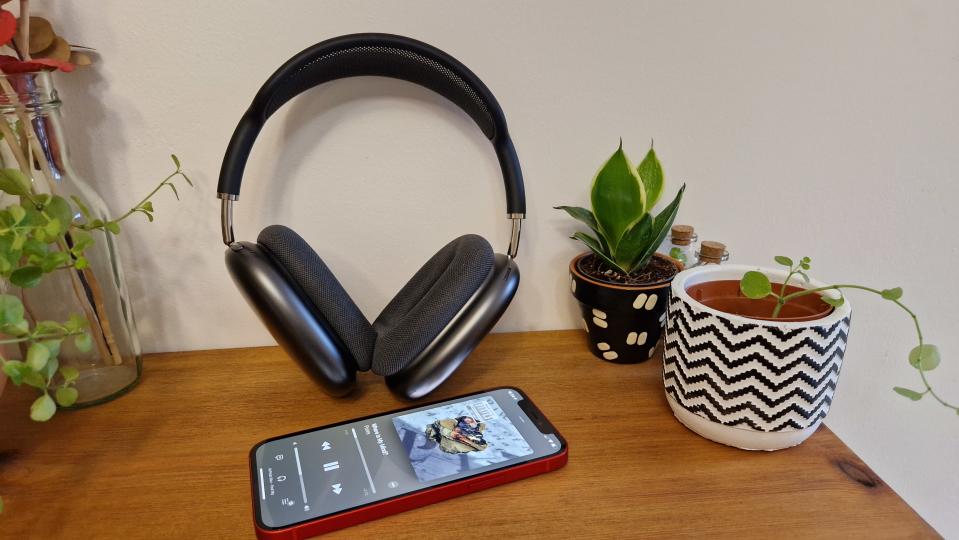 Apple AirPods Max with iPhone 12, next to plants