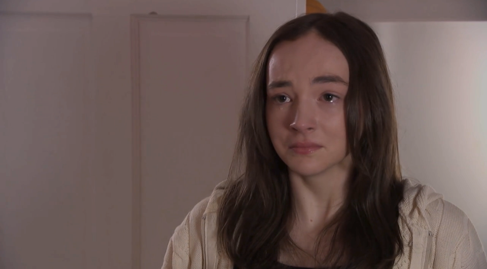 frankie in hollyoaks, a young woman with long brown hair cries