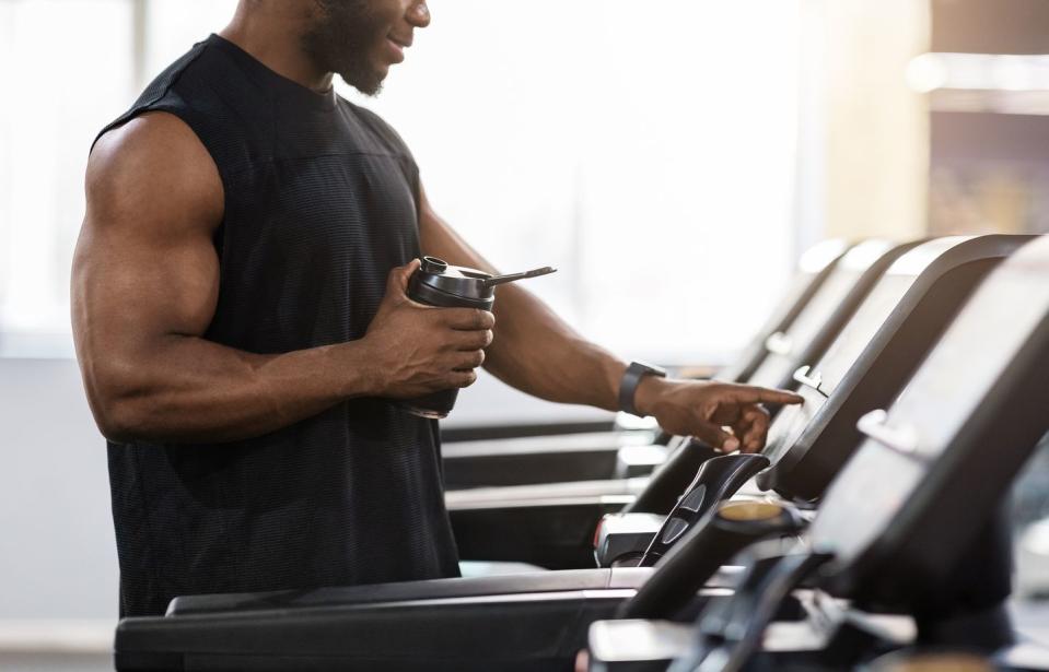 man in gym drinking collagen supplement