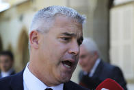 Britain's Brexit Secretary Stephen Barclay talks to the media after a meeting with Cyprus' president Nicos Anastasiades at the presidential palace in Nicosia, Cyprus, Wednesday, Sept. 18, 2019. Barclay is in Cyprus for talks. (AP Photo/Petros Karadjias)