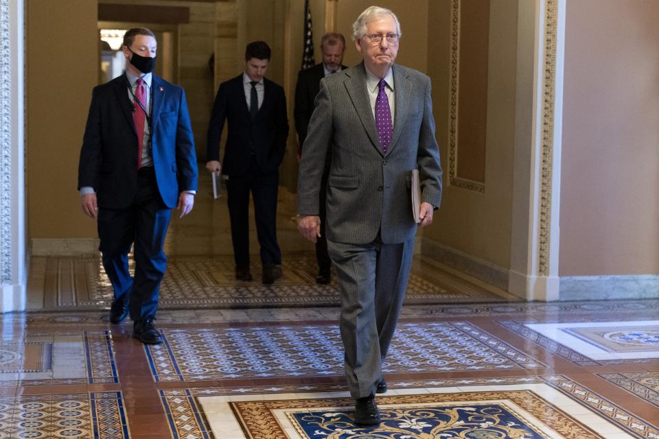 Senate Minority Leader Mitch McConnell, of Ky., walks to the Senate Chamber, Wednesday, Dec. 15, 2021, in Washington. (AP Photo/Jacquelyn Martin)