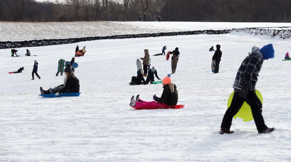 Sledders fill the hillside at Brandywine Creek State Park after a winter storm passed through north Delaware, Saturday, Jan. 29, 2022.