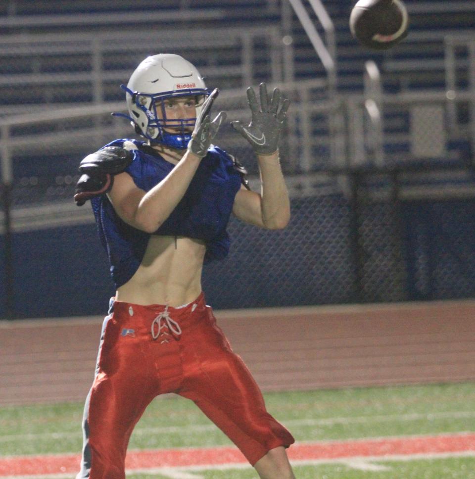 Lakewood's Randall Adkins catches a pass during Midnight Madness at Calhoun Memorial Field on Monday, July 31, 2023.