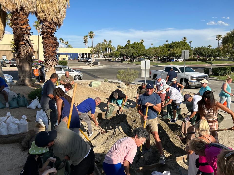 Residents fill sandbags to help prevent flooding ahead of Hurricane Hilary at Palm Springs City Hall on Friday, Aug. 18.