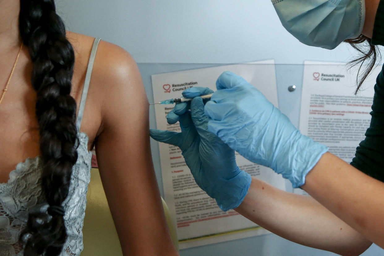 A health worker administers Pfizer Covid-19 vaccine to a woman at a vaccination centre. (Photo by Dinendra Haria / SOPA Images/Sipa USA)