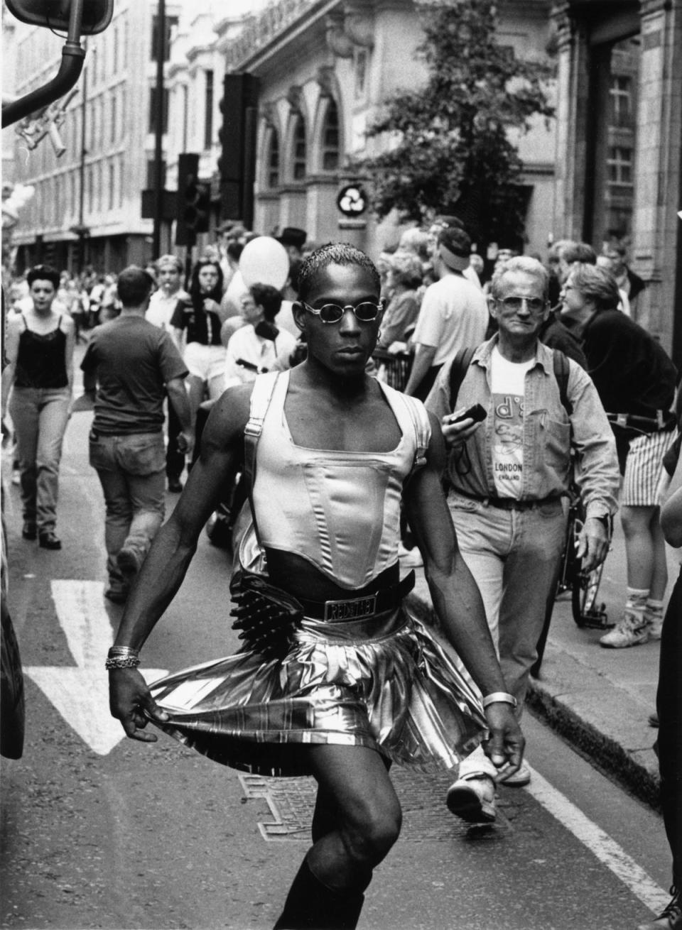 A man wearing clothing walking down a street in London on the day of the Gay Pride march, 26th June 1995 (Steve Eason/Hulton Archive/Getty Images)