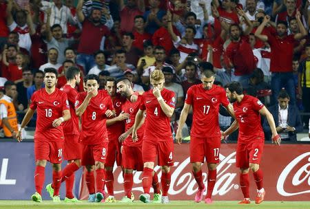 Turkey's players celebrate their second goal against the Netherlands during their Euro 2016 Group A qualifying soccer match in Konya, Turkey, September 6, 2015. REUTERS/Umit Bektas