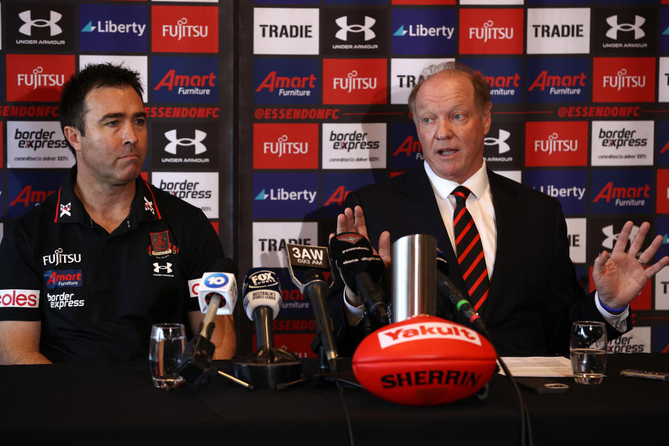 Brad Scott and David Barham, pictured here speaking to the media at an Essendon press conference.