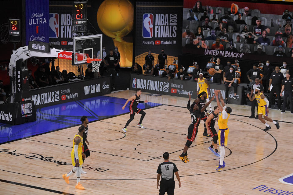 Los Angeles Lakers forward Anthony Davis makes a 3-point basket during the second half in Game 4 of basketball's NBA Finals against the Miami Heat Tuesday, Oct. 6, 2020, in Lake Buena Vista, Fla. (AP Photo/Mark J. Terrill)