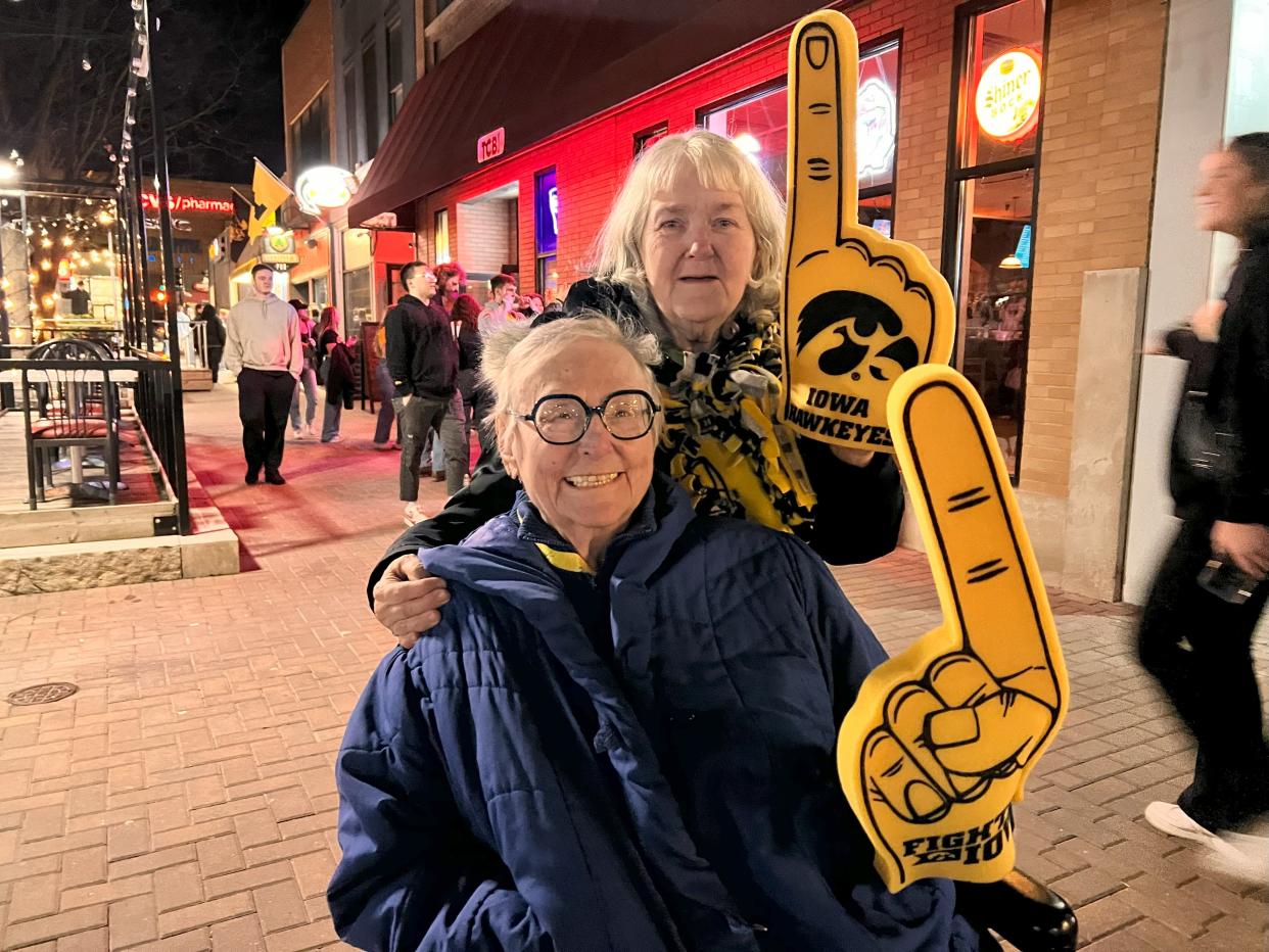 Betty Rosse and Judy Hardesty hit the Pedmall to celebrate with students after watching the game.