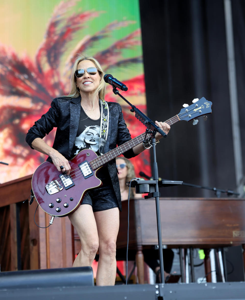 her playing guitar on stage