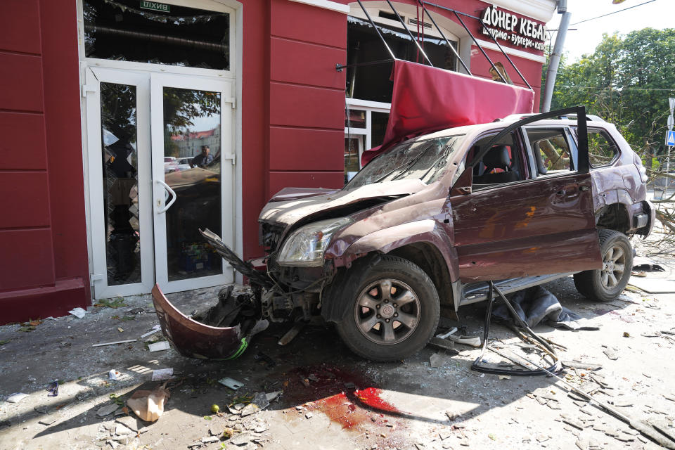 Blood is seen next to a car damaged by Russian attack in Chernihiv, Ukraine, Saturday, Aug. 19, 2023. (AP Photo/Efrem Lukatsky)