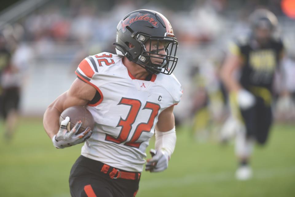 Almont's Chase Battani runs after a catch during a game earlier this season.