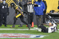 Pittsburgh Steelers wide receiver JuJu Smith-Schuster (19) celebrates after a touchdown catch next to Baltimore Ravens cornerback Tramon Williams during the second half of an NFL football game Wednesday, Dec. 2, 2020, in Pittsburgh. (AP Photo/Don Wright)