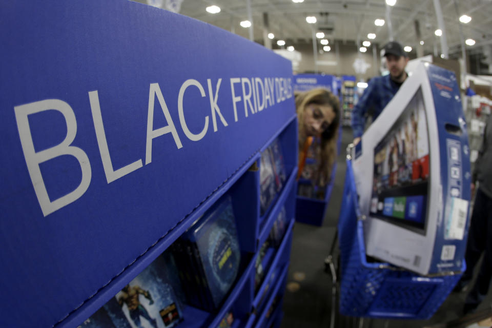People shop at a Best Buy store during a Black Friday sale Thursday, Nov. 28, 2019, in Overland Park, Kan. (AP Photo/Charlie Riedel)