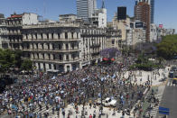 Police block access to people who were waiting to pay final respects to Diego Maradona lying in state at the presidential palace, in Buenos Aires, Argentina, Thursday, Nov. 26, 2020. The Argentine soccer great who led his country to the 1986 World Cup title died Wednesday at the age of 60. (AP Photo/Mario De Fina)