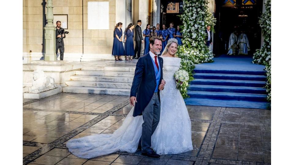 Princess Theodora in wedding dress beside Crown Prince Pavlos