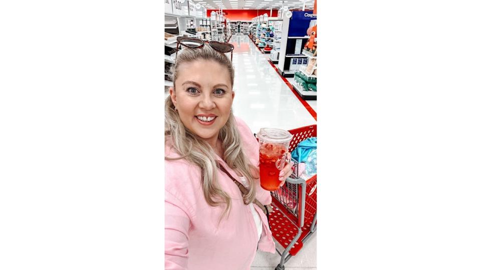 Woman holding an ice drink in the supermarket