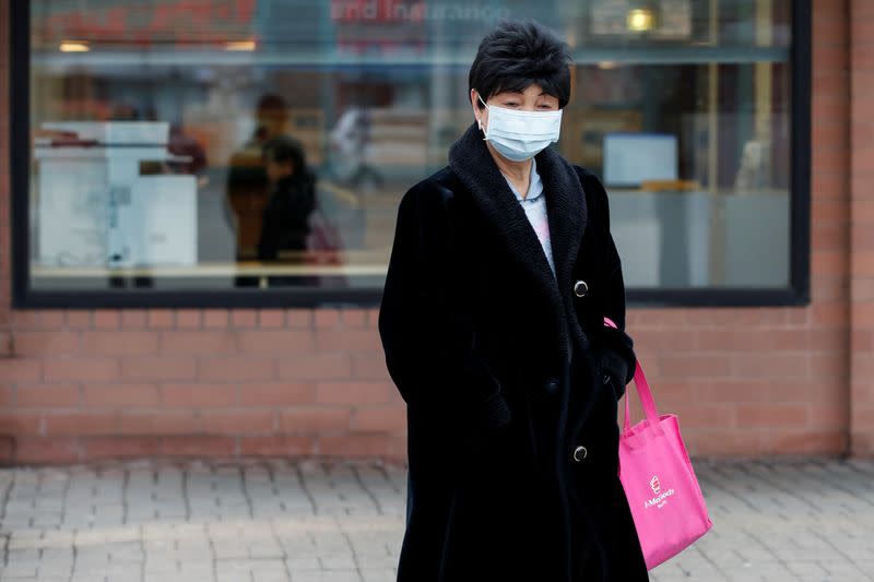 A woman wears a mask following the outbreak of the novel coronavirus, in Chicago