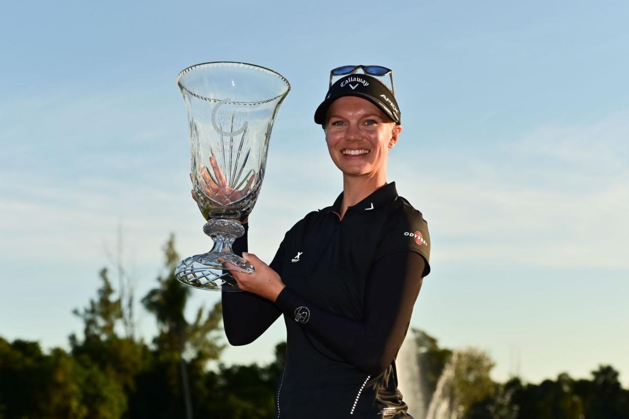 Madelene Sagstrom holds the trophy after winning the 2020 Gainbridge LPGA at Boca Rio. PHOTO PROVIDED