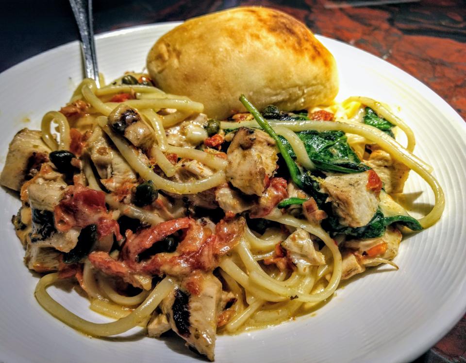 Linguine with grilled chicken, roasted tomatoes, spinach and capers in a garlic cream sauce from Gervasi's Crush House.