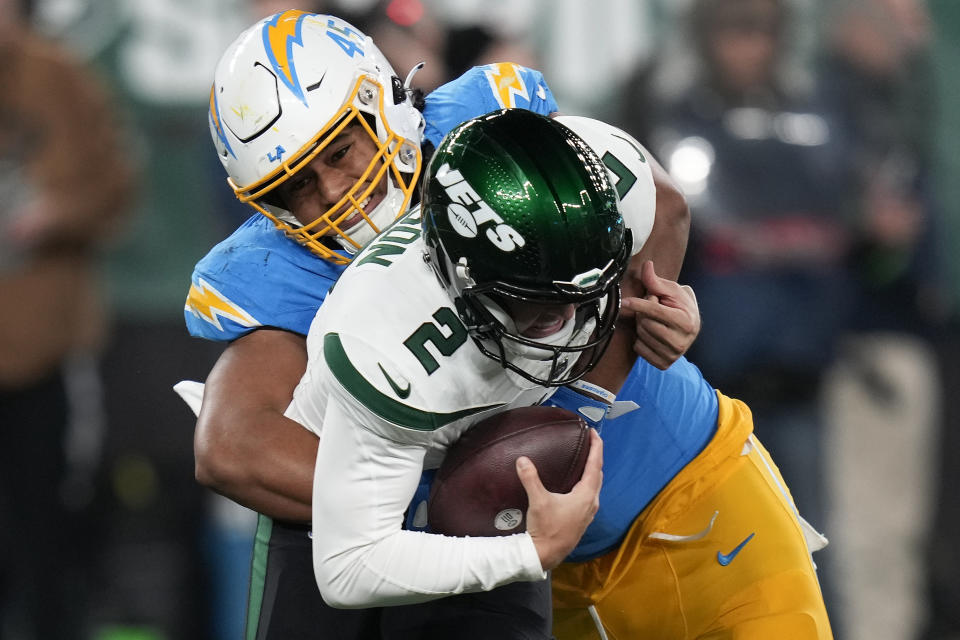 Los Angeles Chargers linebacker Tuli Tuipulotu (45) sacks New York Jets quarterback Zach Wilson (2). It was one of eight sacks Wilson endured on Monday. (AP Photo/Seth Wenig)