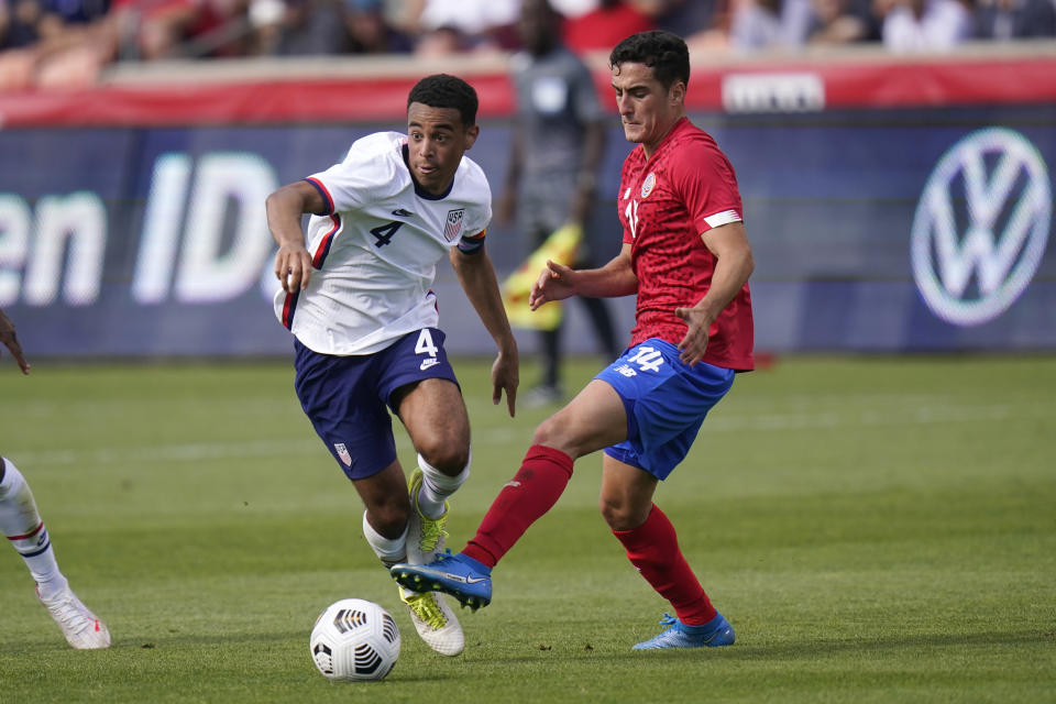 United States Tyler Adams, left, battles against Costa Rica's Bernald Alfaro, right, in the first half during an international friendly soccer match Wednesday, June 9, 2021, in Sandy, Utah. (AP Photo/Rick Bowmer)