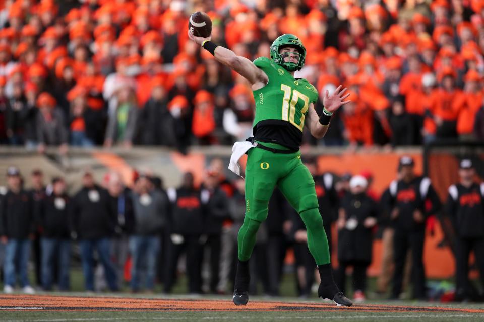 Oregon quarterback Bo Nix (10) passes against Oregon State during the second half of an NCAA college football game on Saturday, Nov 26, 2022, in Corvallis, Ore. (AP Photo/Amanda Loman)