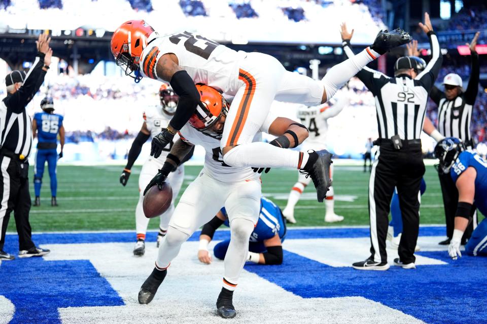 Cleveland Browns linebacker Tony Fields II (42) celebrates with teammate safety Grant Delpit (22) after recovering a fumble by Indianapolis Colts quarterback Gardner Minshew in the end zone for a touchdown during the first half of an NFL football game, Sunday, Oct. 22, 2023, in Indianapolis. (AP Photo/AJ Mast)