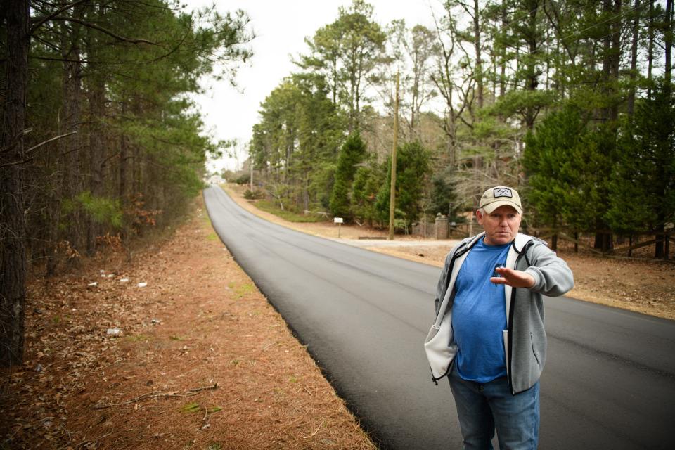 Fayetteville resident Michael Spellman talks about the illegal dumping along Buhmann Drive in Fayetteville.