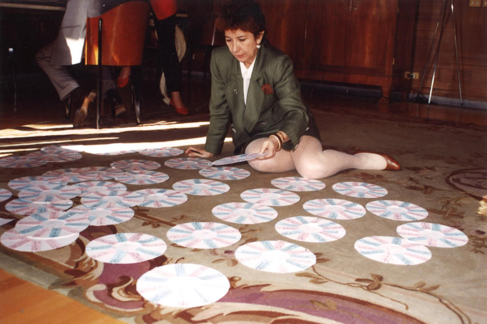 Françoise Dumas works on seating charts at a Valentino event in Rome