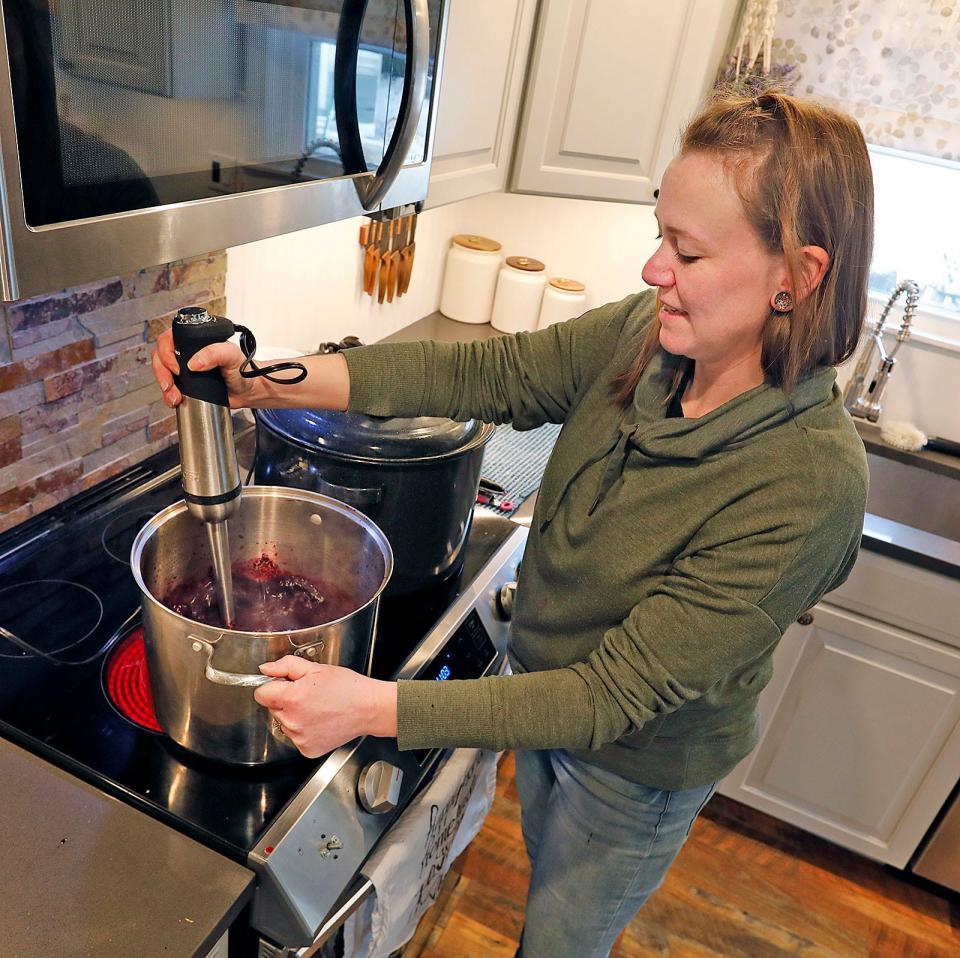 Christine Allison of Plympton blends her Blueberry Lemon jam Wednesday, Feb. 3, 2023.
