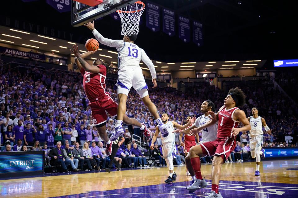 Kansas State guard Desi Sills (13) blocks a shot by Oklahoma guard Otega Oweh (3) during the first half of an NCAA college basketball game in Manhattan, Kan., Wednesday, March 1, 2023. (AP Photo/Reed Hoffmann)