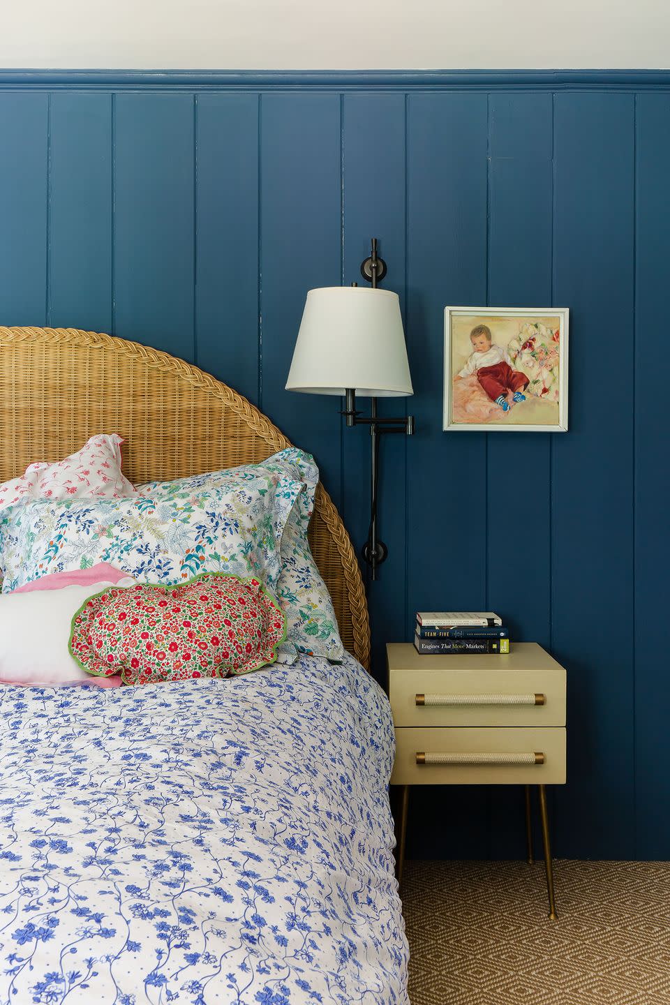 a bed with a blue wall