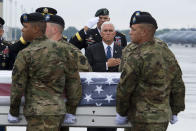 An Army carry team moves a transfer case containing the remains of Army Master Sgt. Jose Gonzalez, 35, of La Puente, Calif., past Vice President Mike Pence, Friday, Aug. 23, 2019, at Dover Air Force Base, Del. According to the Department of Defense, Gonzalez died as a result of wounds sustained from small arms fire while engaged in combat operations in Faryab Province, Afghanistan, while supporting Operation Freedom's Sentinel. (AP Photo/Cliff Owen)