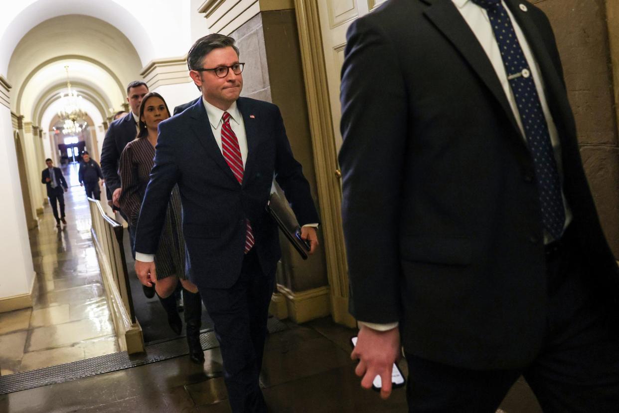 <span>The House speaker, Mike Johnson, returns to his office after Marjorie Taylor Greene introduced a motion to vacate him in Washington DC on 22 March 2024.</span><span>Photograph: Kevin Dietsch/Getty Images</span>