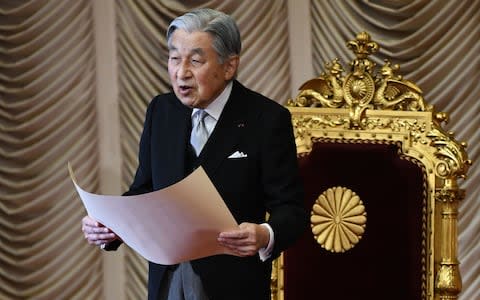 Emperor Akihito delivers a speech at the opening ceremony of the extraordinary Diet session in Tokyo on October - Credit:  KAZUHIRO NOGI/ AFP