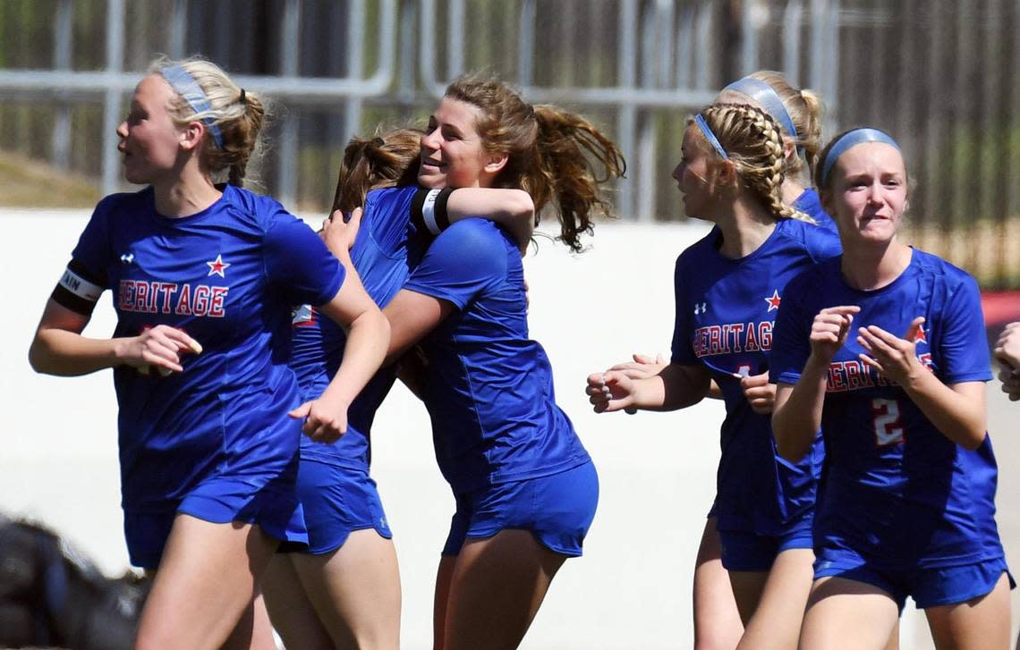 Midlothian Heritage’s Jules Burrows, center right celebrates with teammates after scoring the winning goal to take a 2-1 lead over Argyle with 5:47 left in the second half of the Region 1-4A girls soccer final Saturday, April 9, 2022 at Northwest ISD Stadium in Justin Texas. Special/Bob Haynes