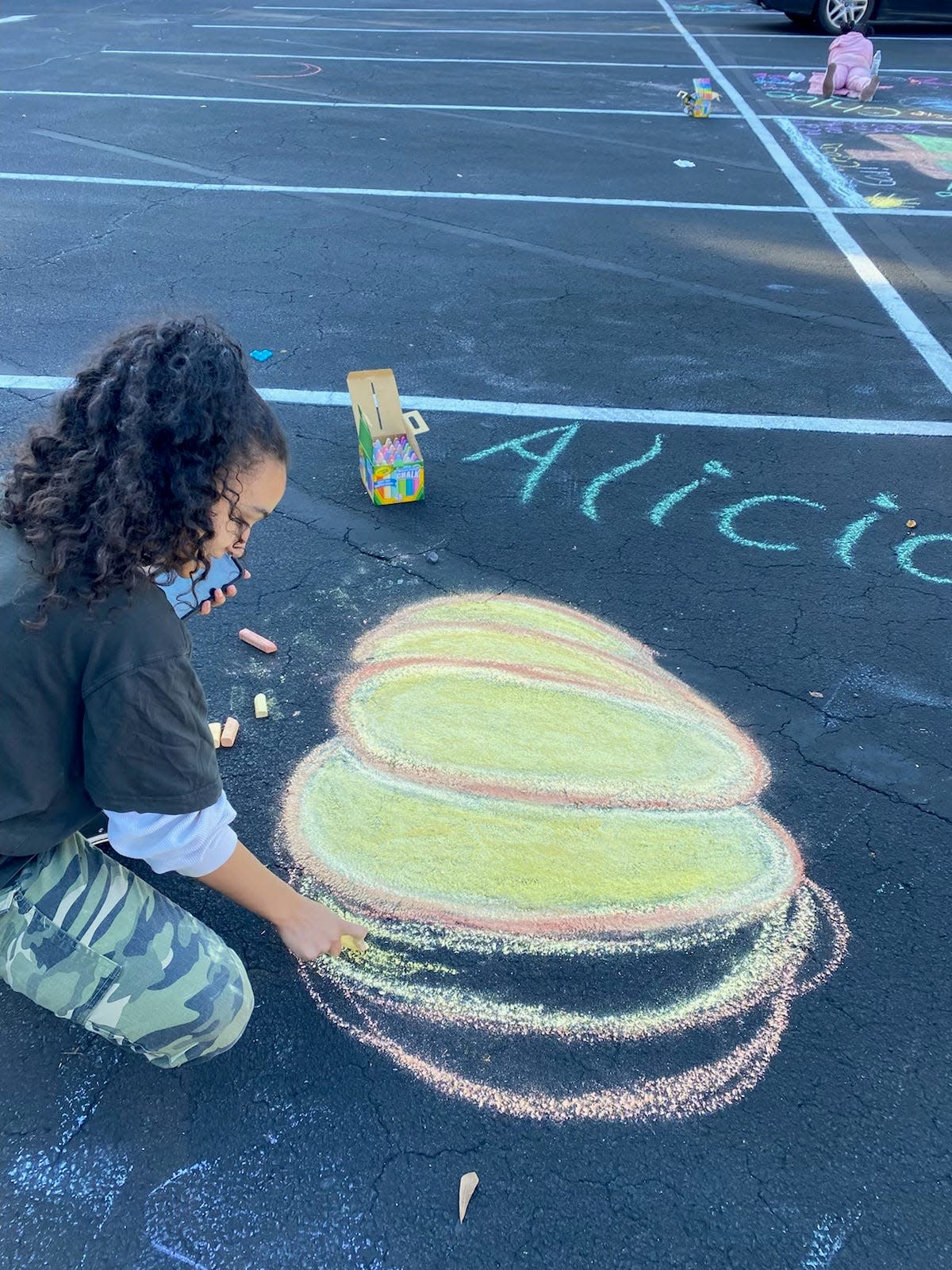 Alicia Doornewerd works on her design at Shiloh Baptist Church’s Chalk It Up Bash on Oct. 15.