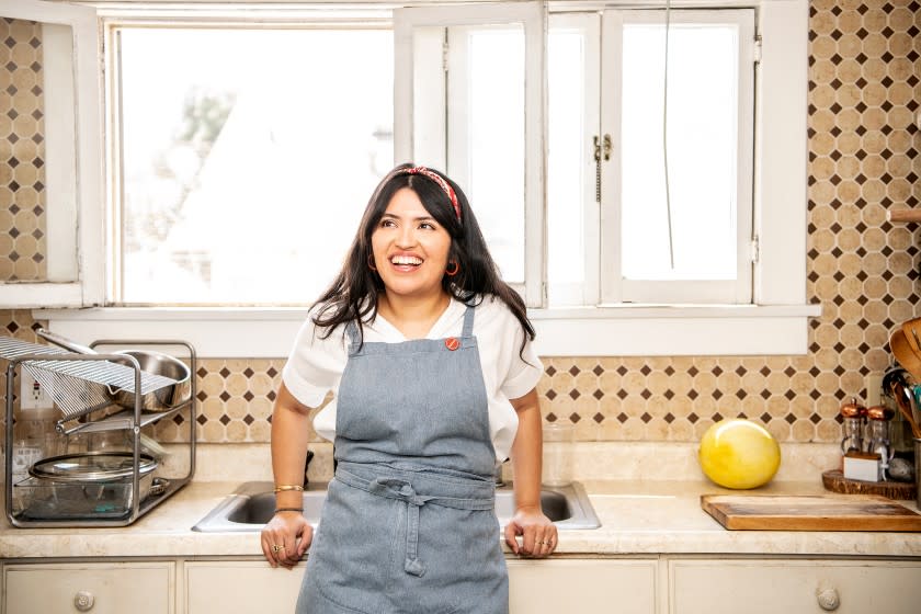 LOS ANGELES, CA - SEPTEMBER 02: Food writer and online cooking instructor, Karla Vasquez, inside her kitchen on Wednesday, Sept. 2, 2020 in Los Angeles, CA. Vasquez has been working on a cookbook project, SaviSoul, where Salvadoran cuisine and the stories behind the recipes are showcased and honored. (Mariah Tauger / Los Angeles Times)