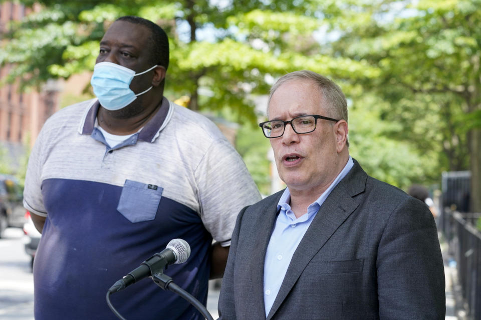 New York City Comptroller and Democratic mayoral candidate, Scott Stringer, right, is joined by the President of the St. Nicholas Houses Association, Tyrone Ball as he speaks to reporters during a campaign news conference, Wednesday, June 9, 2021, in New York. (AP Photo/Mary Altaffer)