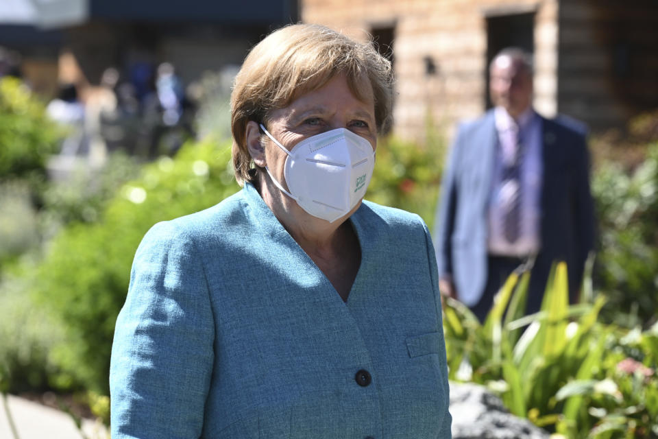 German Chancellor Angela Merkel arrives at an official welcome at the G7 summit in Carbis Bay, Cornwall, England, Saturday, June 12, 2021. (Leon Neal/Pool Photo via AP)