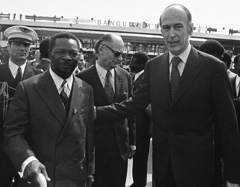 In this March 6, 1975 file photo, The President of the Central African Republic Jean-Bedel Bokassa with French President Valery Giscard d'Estaing during a visit by the latter to Bangui, Central African Republic in Bangui. Valery Giscard d’Estaing, the president of France from 1974 to 1981 who became a champion of European integration, has died Wednesday, Dec. 2, 2020 at the age of 94, his office and the French presidency said. (AP Photo, File)