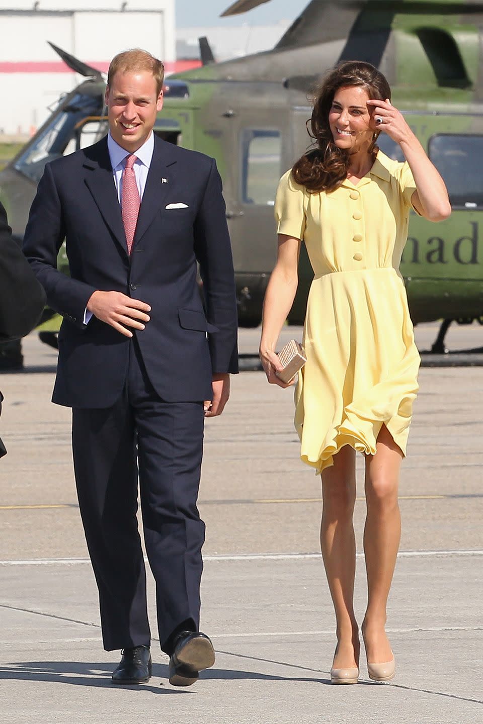 <p>The Queen has reportedly prohibited royal women from baring their knees in public, which leaves Kate Middleton’s 2011 breezy, yellow dress on her list of no-nos. </p>