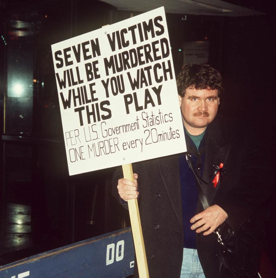 A protester picketing the premiere of The Capeman - Walter McBride/Retna